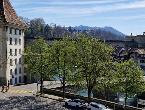 a view of a city with cars parked on a street at Hotel & Bistro Pêle-Mêle in Bern