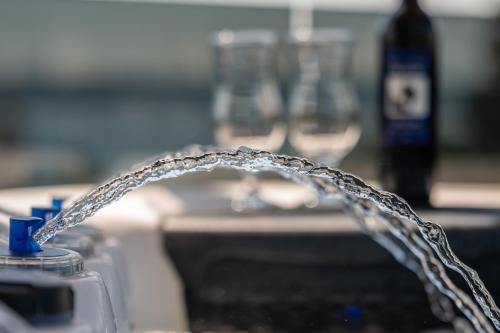 a close up of a water hose in a sink at Penthouse FRANITA 50 meters from the beach in Kaštela