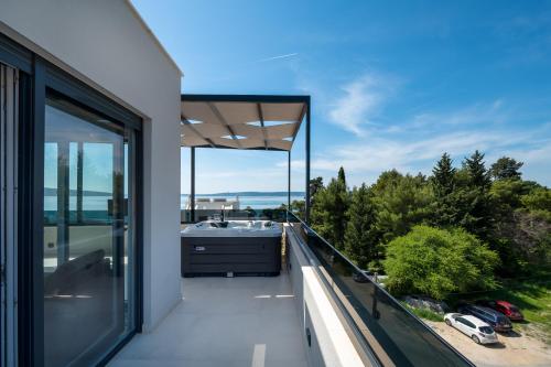 a view from the balcony of a house at Penthouse FRANITA 50 meters from the beach in Kaštela