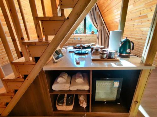an attic room with a counter in a cabin at turpan Ah Fanti Village in Turfan