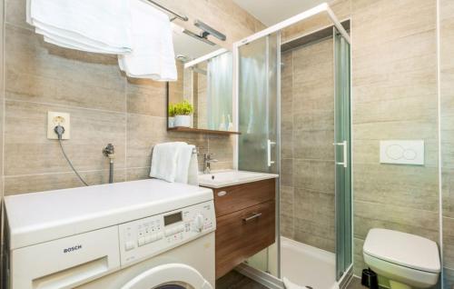 a bathroom with a toilet and a sink and a shower at Vila Iris - Opatija by Villas Guide in Breza