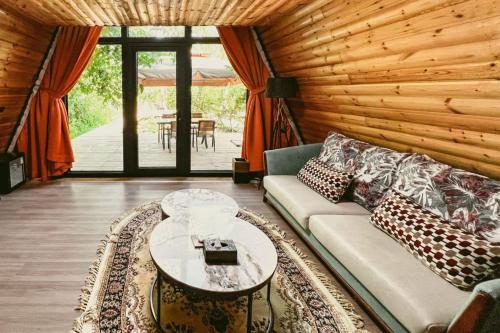 a living room with a couch and a table at turpan Ah Fanti Village in Turfan