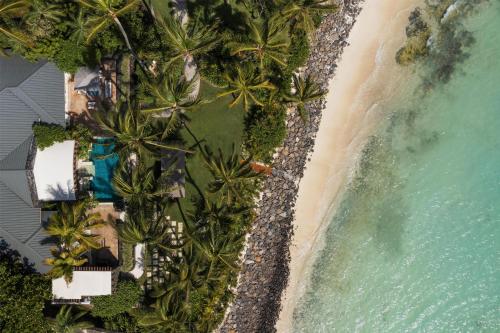 an aerial view of the beach and the ocean at One&Only Le Saint Géran, Mauritius in Belle Mare