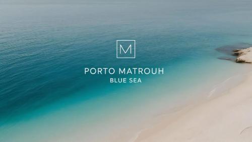 a picture of the ocean and a beach at Porto matrouh Blue sea in Marsa Matruh