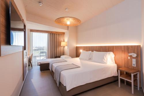 Ένα ή περισσότερα κρεβάτια σε δωμάτιο στο BANCAL HOTEL and SPA