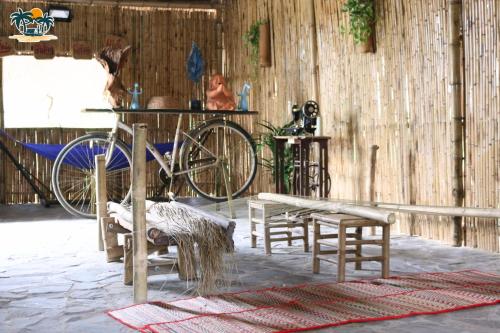 a room with a bike and a table and chairs at Ann Homestay in Can Tho