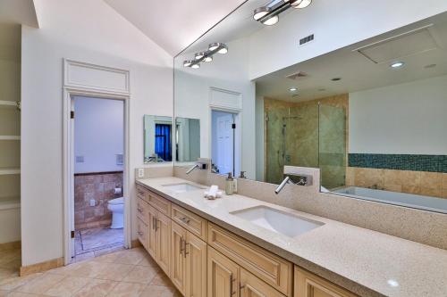 a bathroom with a sink and a toilet and a mirror at 6BR-Music Studio-Pool-Spa & Games in Sherman Oaks