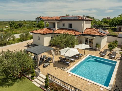 an aerial view of a villa with a swimming pool at Villa La Aurora ZadarVillas in Murvica