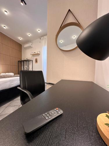 a remote control sitting on a table in a room at Priority Boarding in Naples
