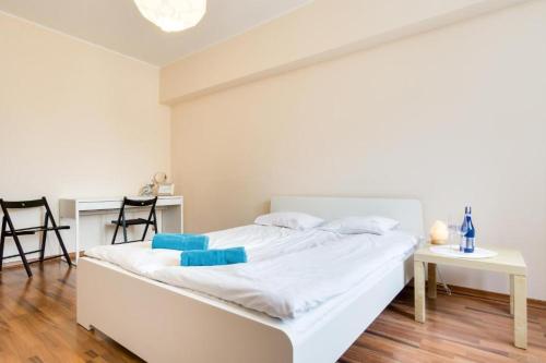 Una cama o camas en una habitación de Elite Apartments Korzenna City Center