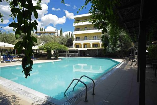 a large swimming pool in front of a building at Miramare in Eretria