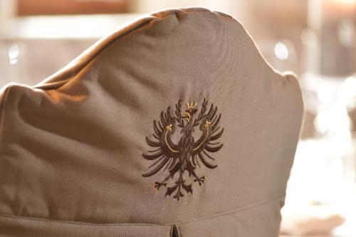 a close up of the back of a brown dress with a black design at Hotel Glockenstuhl in Westendorf