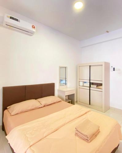 a bedroom with a bed and a air conditioner at Studio with Rooftop Pool at Youth City Nilai by D'KAY HOMES, near USIM KLIA in Nilai