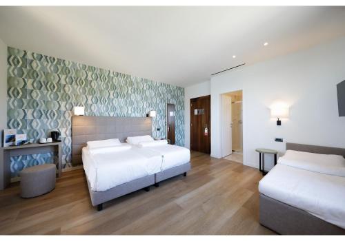 Ένα ή περισσότερα κρεβάτια σε δωμάτιο στο Hotel Residence Zust