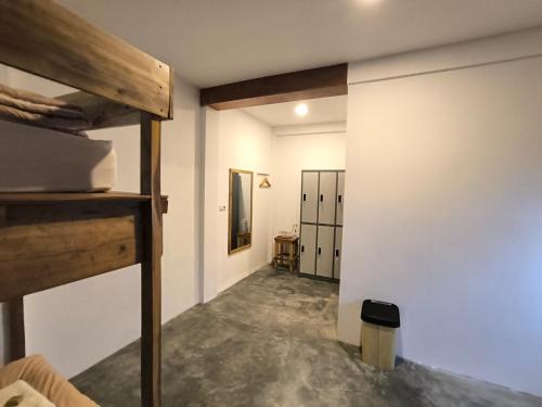 a room with a bunk bed and a hallway at Maison Manendra - Bromo in Gubukklakah