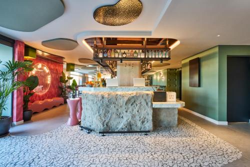 a bar in a restaurant with a marble counter at Ibis Styles Madrid Airport Valdebebas in Madrid