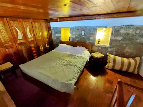 a bedroom with a bed in a room at Elounda Traditional Homes of Crete in Elounda