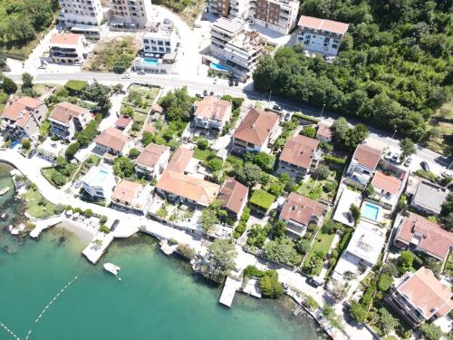 an aerial view of a residential estate next to a river at Montenegro Apartmant's in Kotor