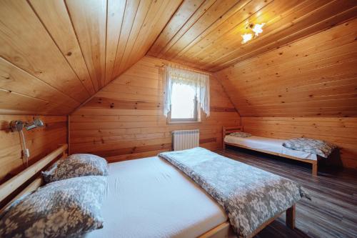 Posteľ alebo postele v izbe v ubytovaní Domek Karkonosze