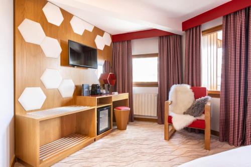 Et tv og/eller underholdning på Royal Ours Blanc Boutique Hôtel & Spa