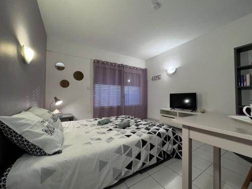 Ένα ή περισσότερα κρεβάτια σε δωμάτιο στο Appartement Lilas - Résidence Kiwi