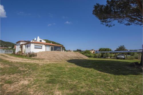 a house sitting on top of a pile of dirt at La Sciumara with beach access - Happy Rentals in Cannigione