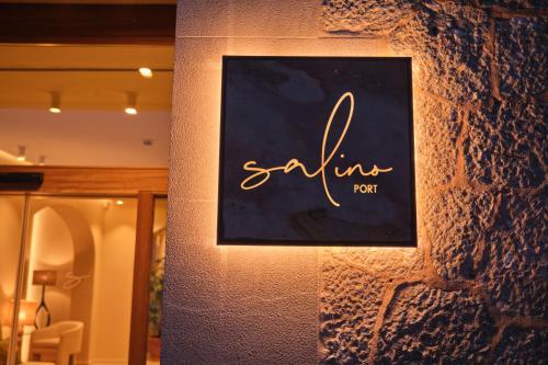 a sign on the side of a building at Salino Port Soller in Port de Soller