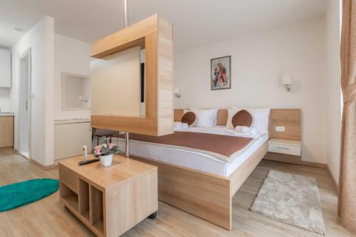 Postel nebo postele na pokoji v ubytování Hotel Onogošt