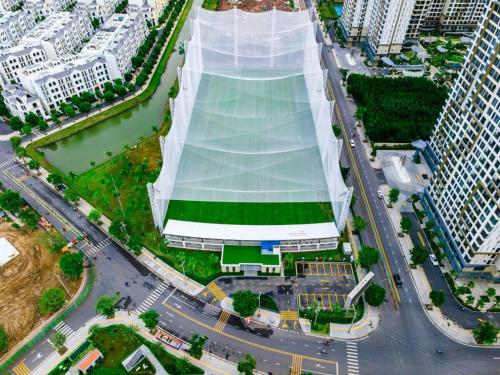 an overhead view of a large white building with a soccer field at Origami 2BR view Green and Pool in Long Bình