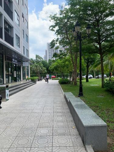 a sidewalk in a city with a street light and trees at Origami 2BR view Green and Pool in Long Bình