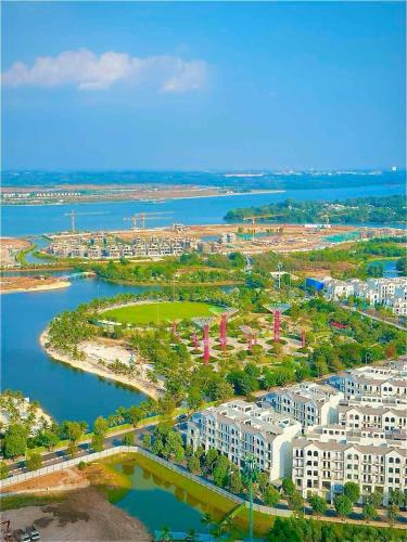 an aerial view of a city next to a body of water at Origami 2BR view Green and Pool in Long Bình