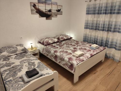Posteľ alebo postele v izbe v ubytovaní Guesthouse Eljuga Family