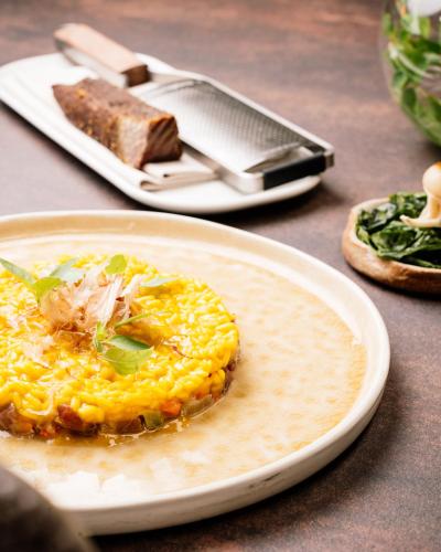 a plate with an omelet on a table at Relais Bellaria Hotel & Congressi in Bologna
