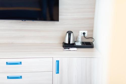 a counter with a tv and a coffee maker on it at Suites in the Amalfi Coast - GuestHouse with Terrace near Amalfi - Breathtaking View of Ravello in Scala