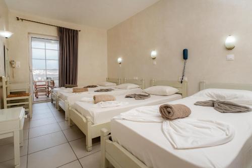 Cama o camas de una habitación en Sunrise Hotel