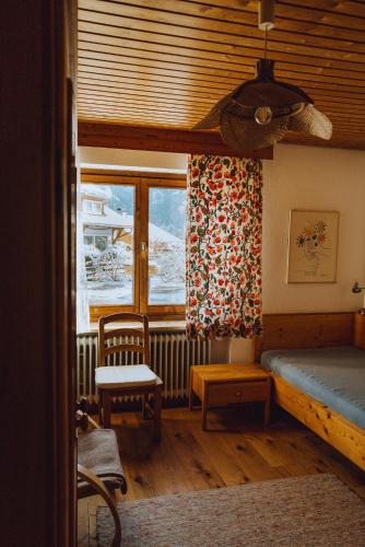 a bedroom with a bed and a window at Haus am Weiher in Schwangau