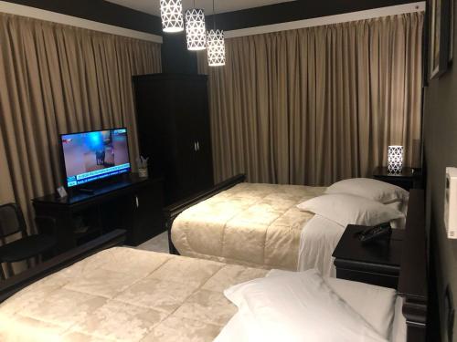 Postel nebo postele na pokoji v ubytování Dream's Hotel