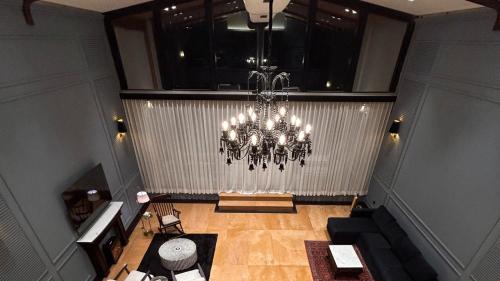an overhead view of a room with a chandelier at Polo Cherrapunjee Resort in Cherrapunji