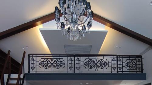 a chandelier hanging from a ceiling in a house at Polo Cherrapunjee Resort in Cherrapunji