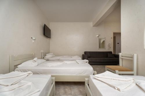 Cama o camas de una habitación en Sunrise Hotel