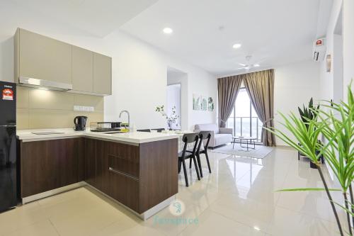 a kitchen and living room with a counter and chairs at Jalan Puchong - 3B2B - 7 pax - 7 min to AEON BiG & Train in Puchong