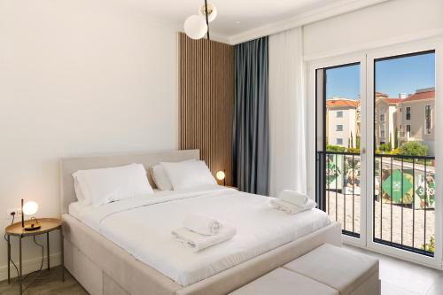 Postel nebo postele na pokoji v ubytování Nana & Nona Luštica Bay