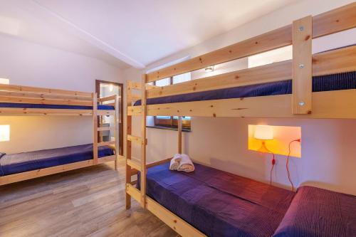 Ένα ή περισσότερα κρεβάτια σε δωμάτιο στο La Contredda Portobello