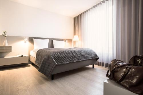 Letto o letti in una camera di Maximilians Boutique-Hotel Landau