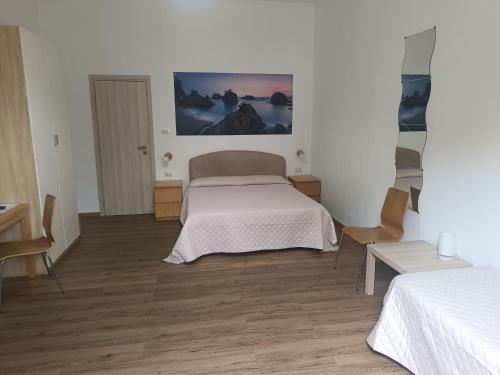 Postel nebo postele na pokoji v ubytování B&B Stella Marina