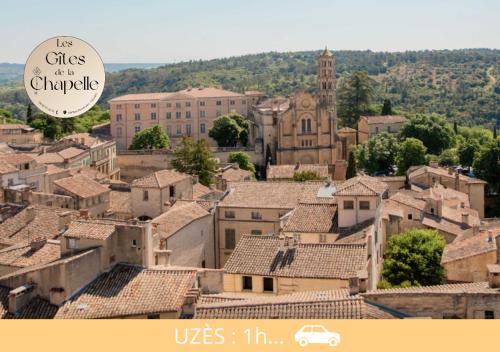 a view of a town with a church and roofs at Les Gîtes de la Chapelle 4 in Vauvert