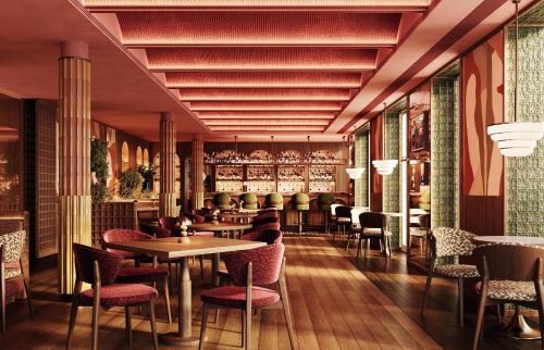 a restaurant with tables and chairs and a bar at METT Barcelona GL - A Leading Hotel of the World in Barcelona