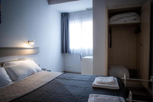 Ένα ή περισσότερα κρεβάτια σε δωμάτιο στο Apartamentos Comfort Calella