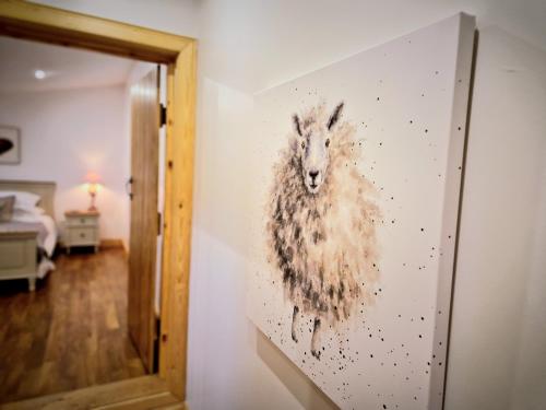 a painting of a koala hanging on a wall at Borlum House in Thurso