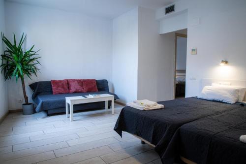 Ένα ή περισσότερα κρεβάτια σε δωμάτιο στο Apartamentos Comfort Calella